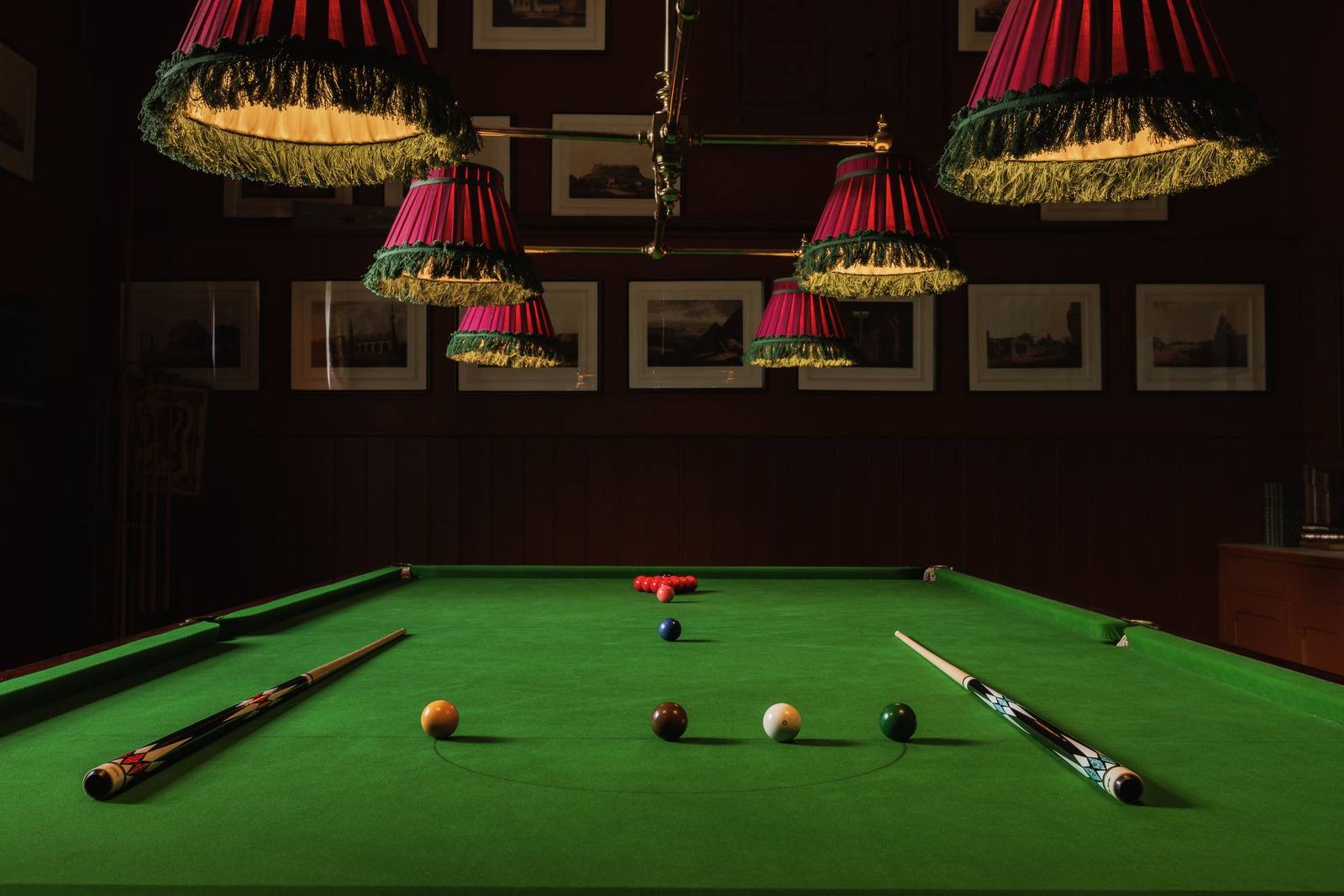 The billiards room at Birkhill Castle, fringed lamps over a full-size snooker table