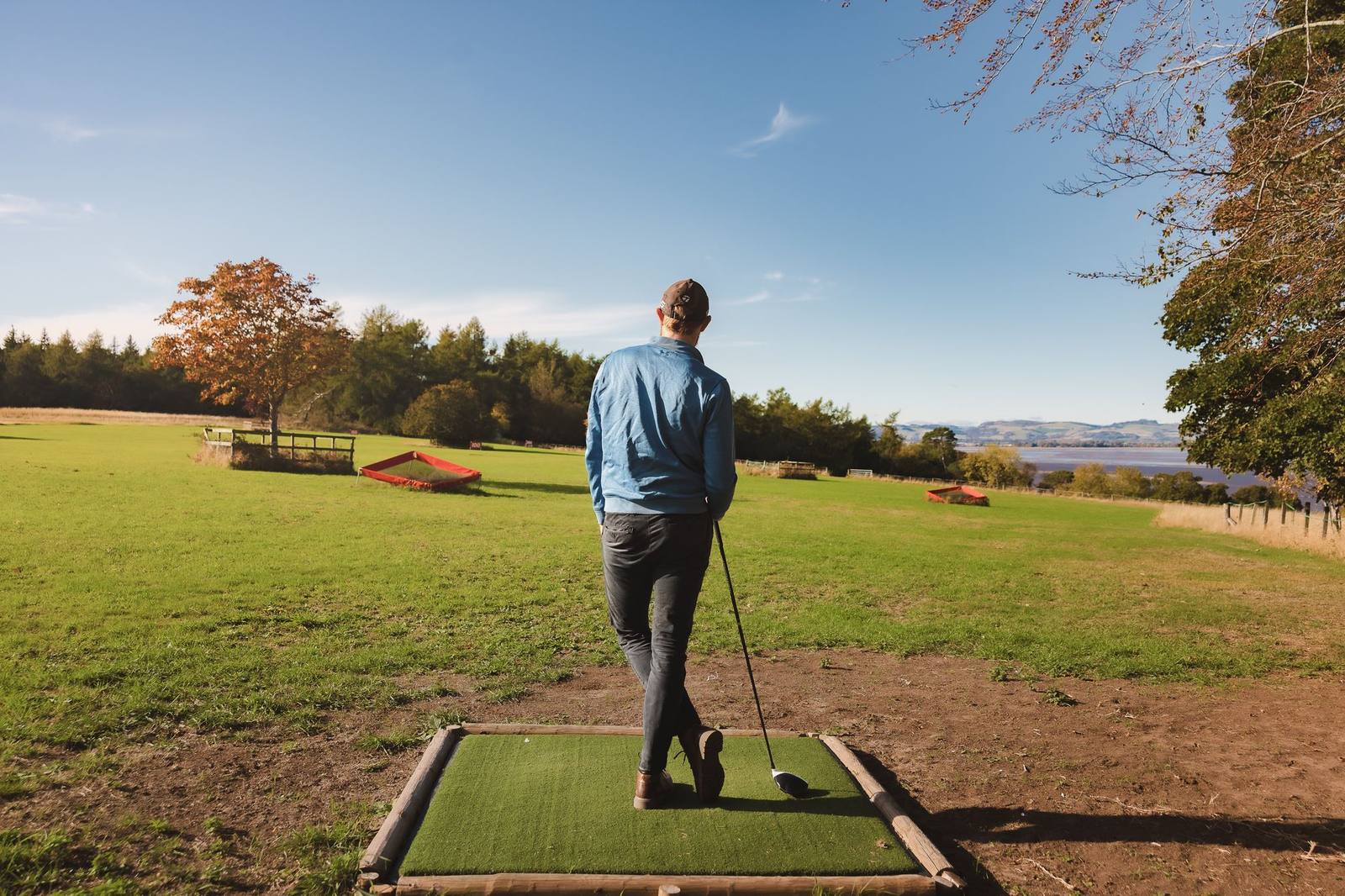 A guest at the private driving range on the Birkhill estate, overlooking the Firth of Tay