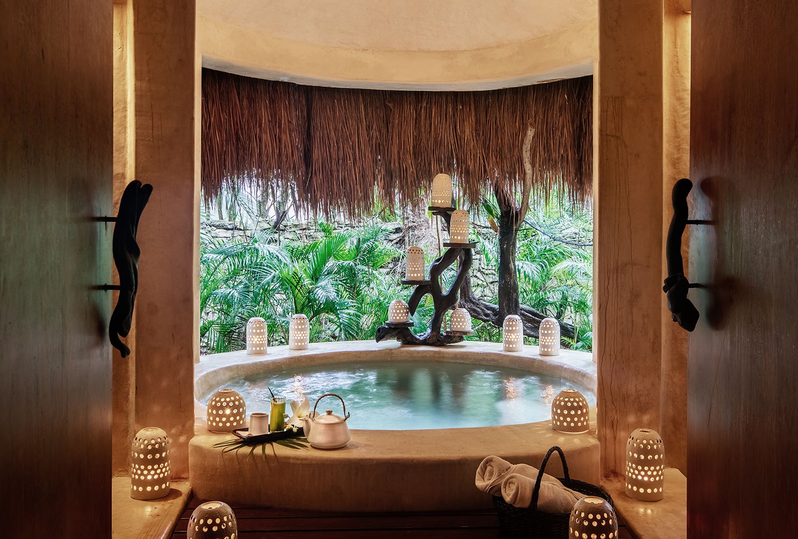 Treatment bath opening onto the jungle at Esencia Spa