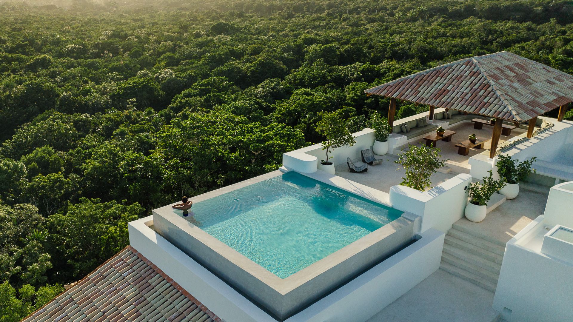 Rooftop pool of the Esencia Mansion above the jungle canopy