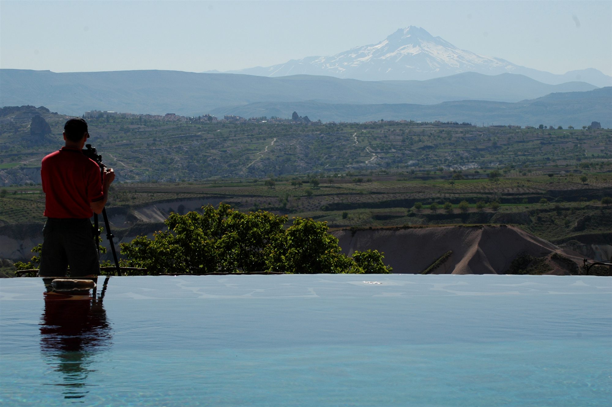 Snow-capped Mount Erciyes seen across Cappadocia from the infinity pool at Museum Hotel