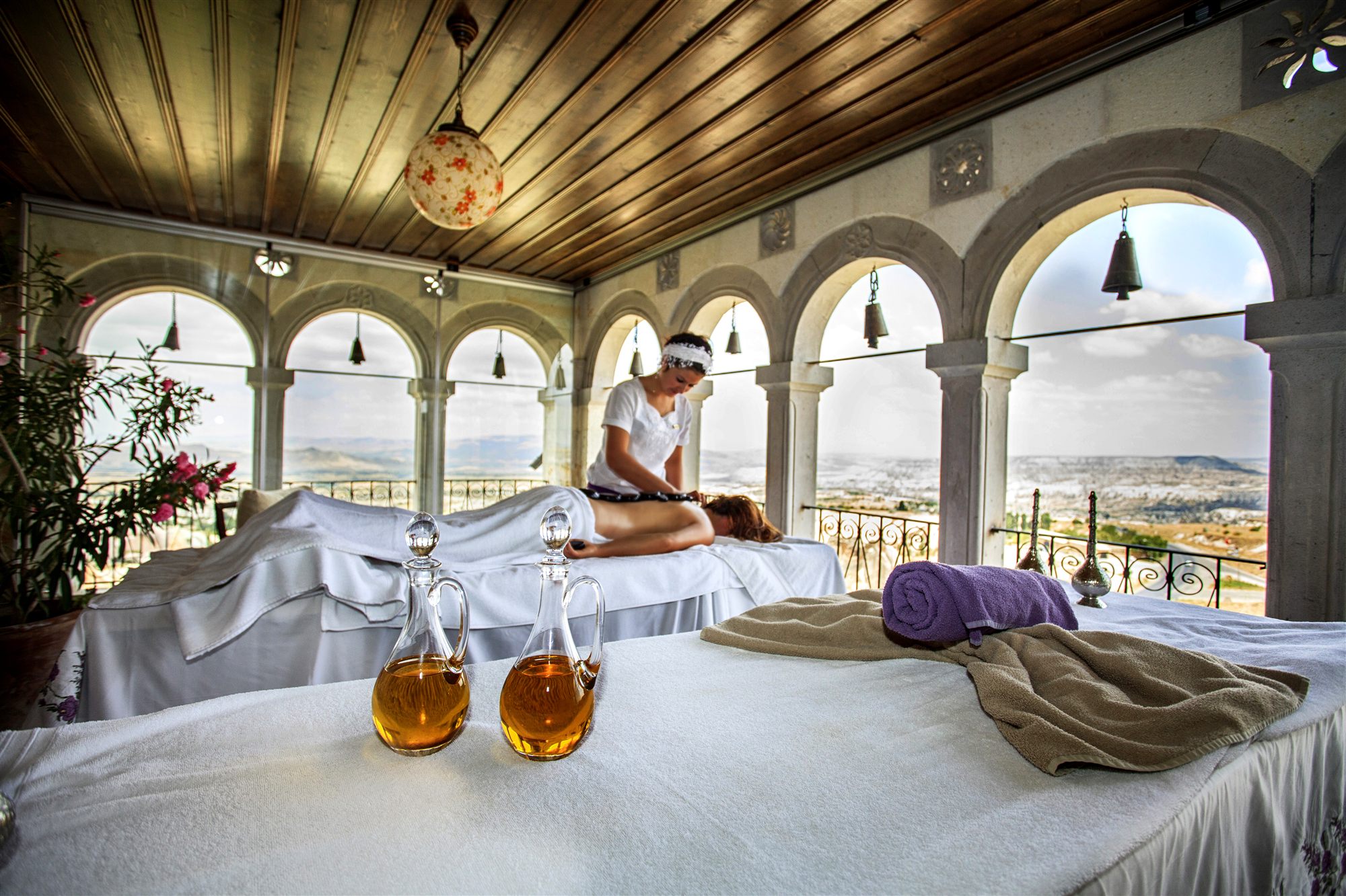 Massage room with arched windows overlooking the Cappadocia valleys at Museum Hotel