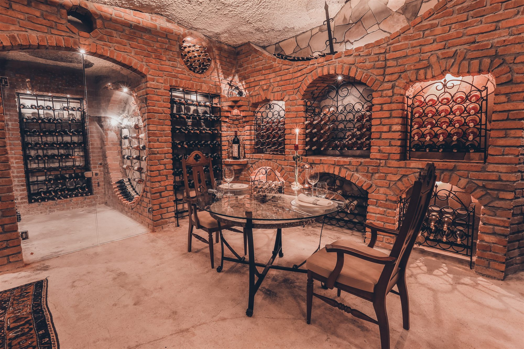 Brick-vaulted wine cellar with a private dining table at Museum Hotel, Cappadocia