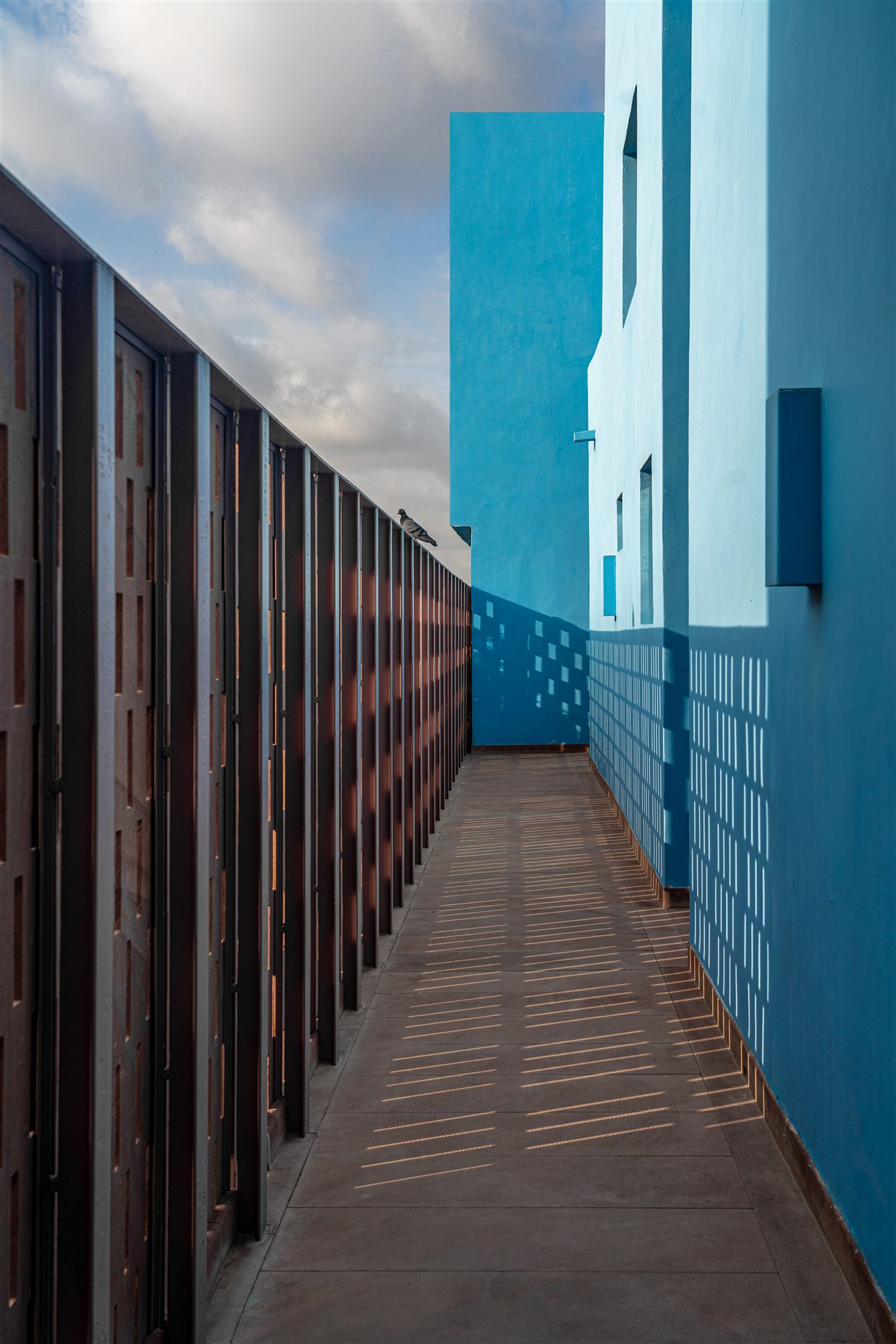 Blue-washed walls and a sandstone walkway in the old city of Jodhpur, Rajasthan