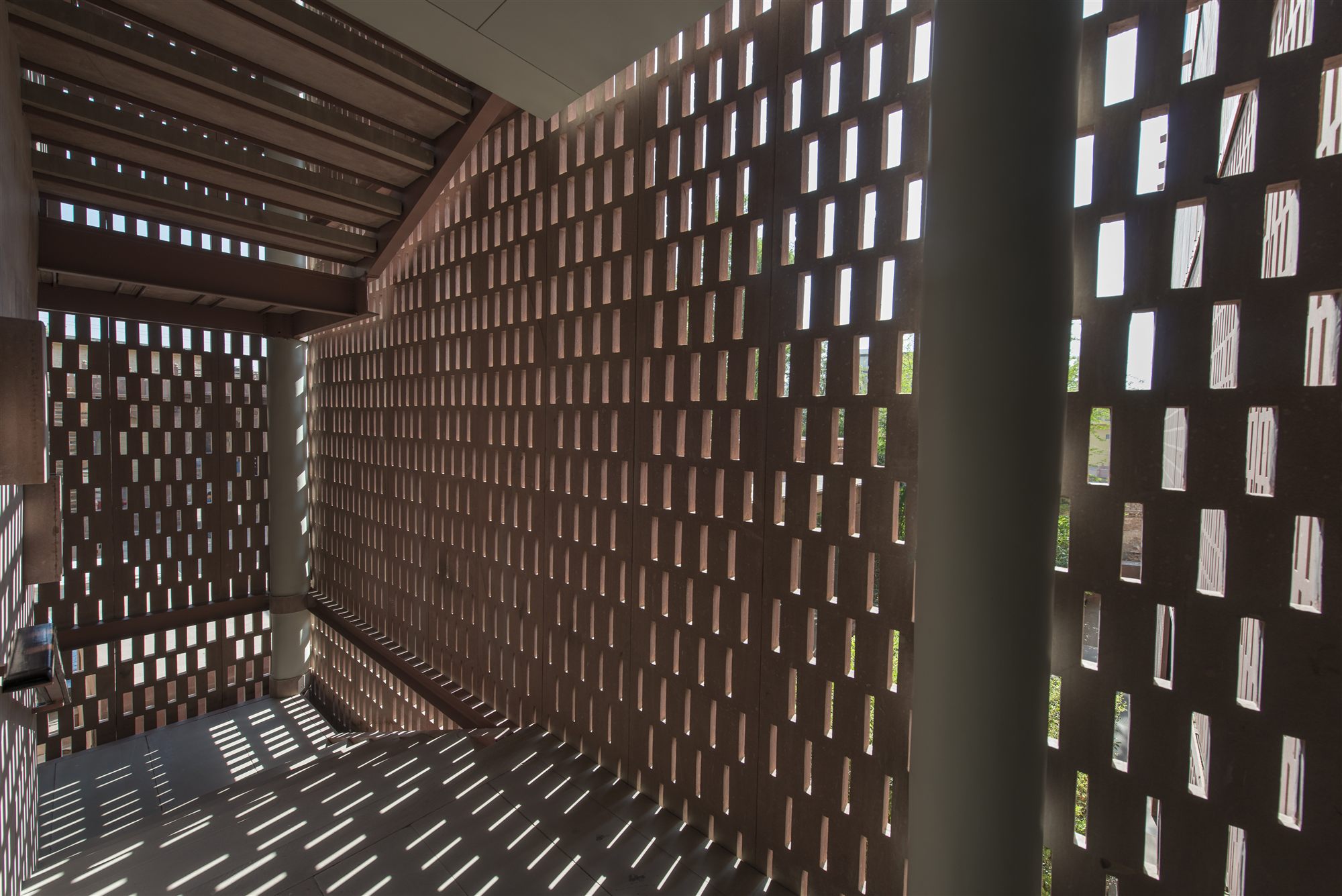 Sunlight casting patterned shadows through the sandstone jaali screens at RAAS Jodhpur