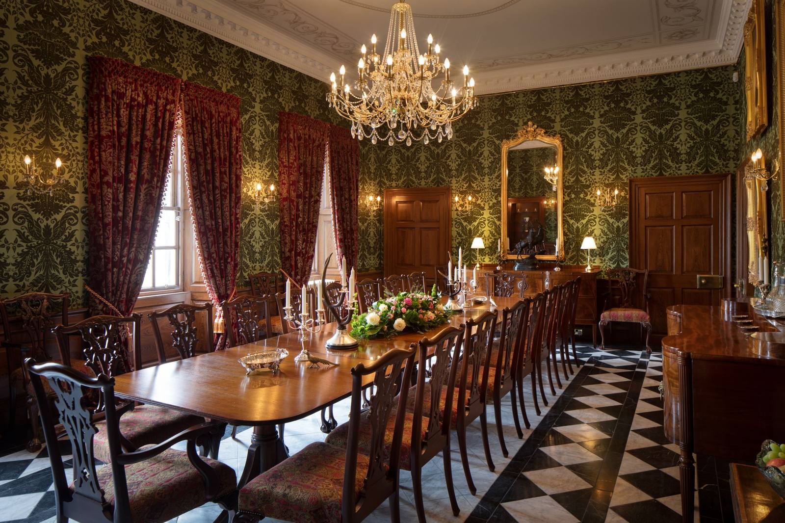 Killochan's dining room, a long table beneath a chandelier