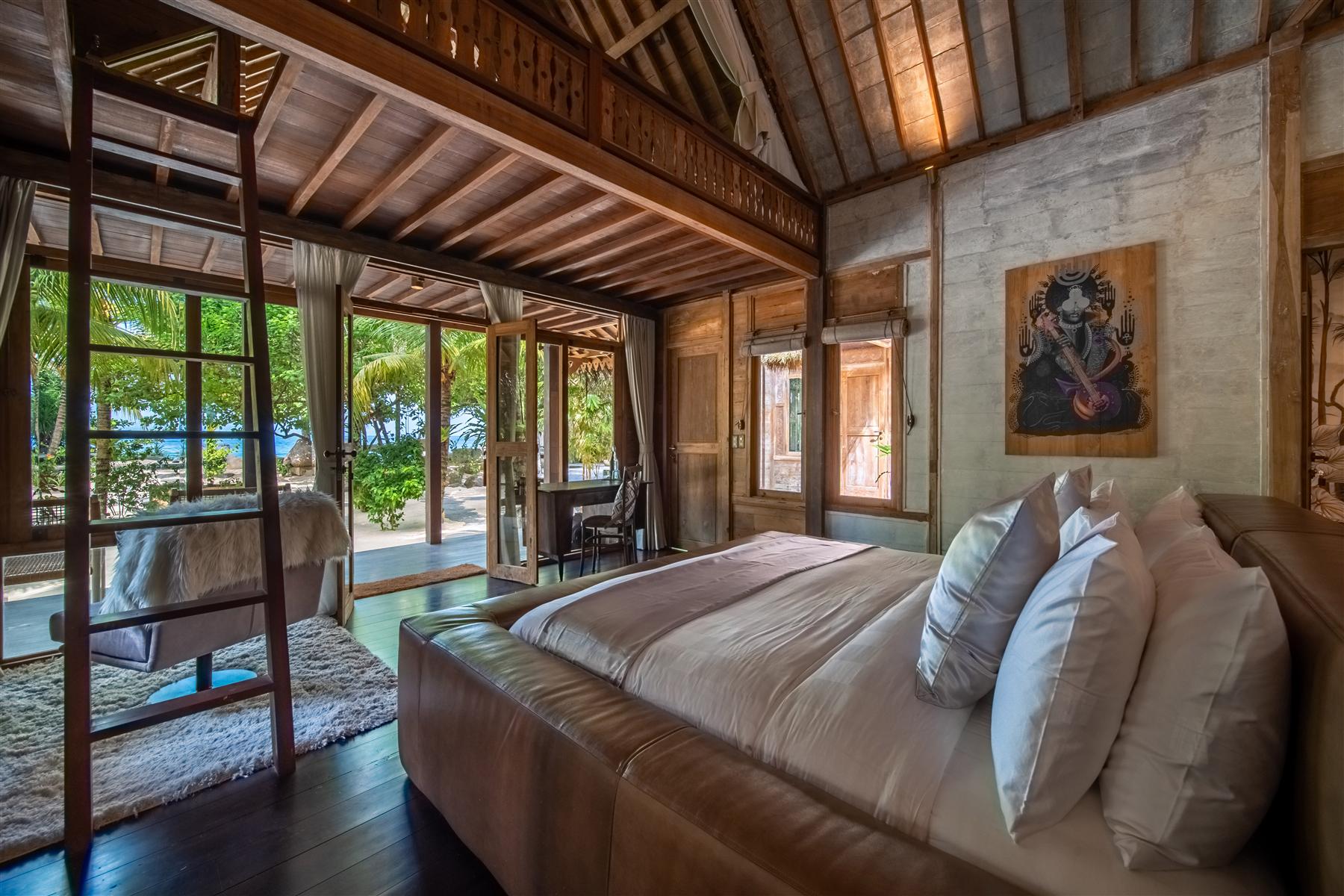 The Platinum Room bedroom in Villa Underground at The Seed, Bali, with vaulted timber ceiling