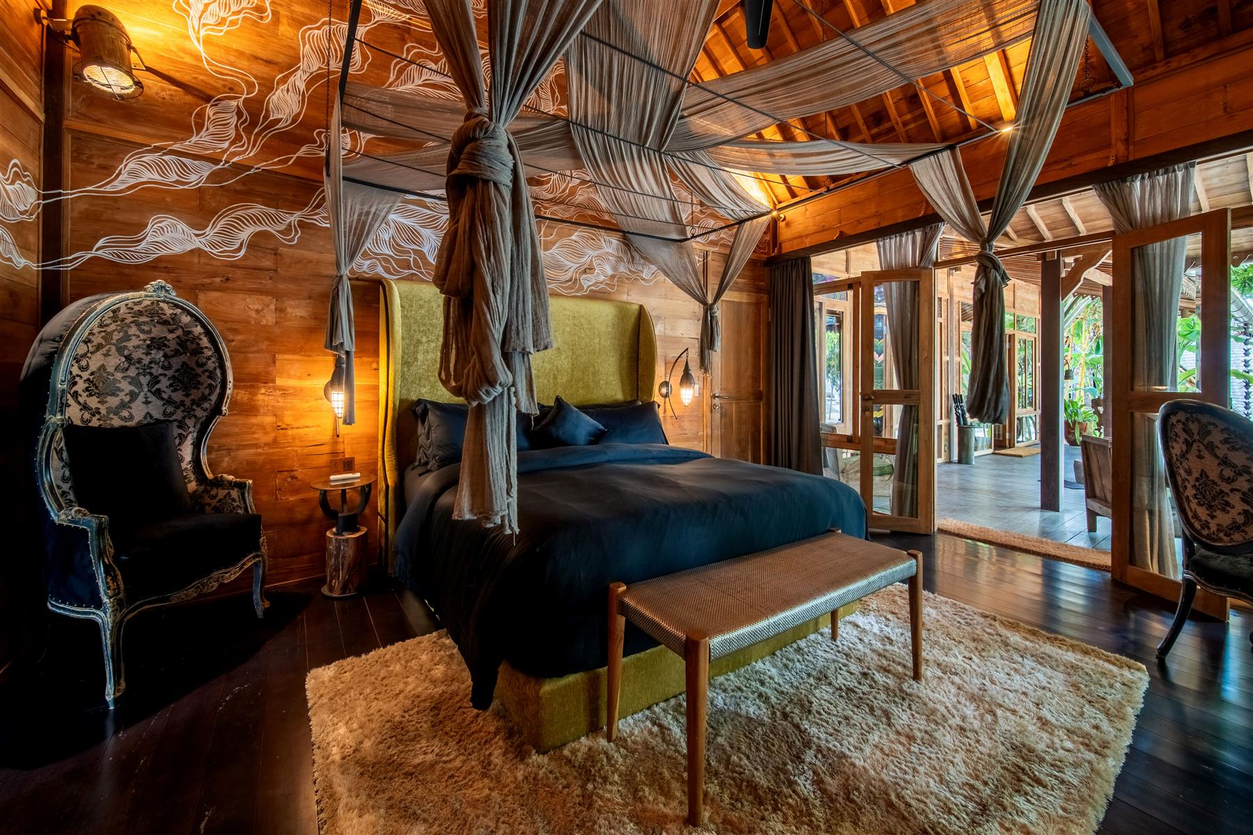Villa Rabbithole master bedroom with four-poster bed and timber ceiling at The Seed, Bali